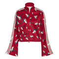 Red cropped athletic top with high neck zip, white triple stripes, floral print