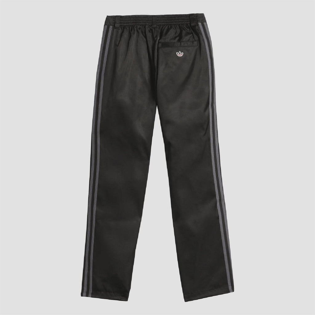 Black track pants with elastic waistband and twin side stripe accents