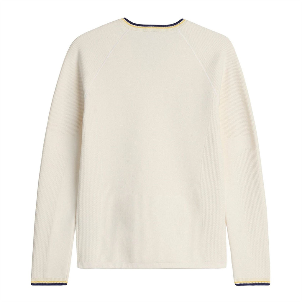 Cream knit long-sleeve crewneck top with navy and yellow trim at cuffs