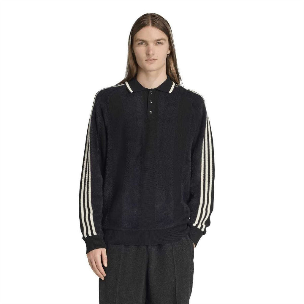 Navy-black collared raglan sweater with white triple stripe bands on sleeves