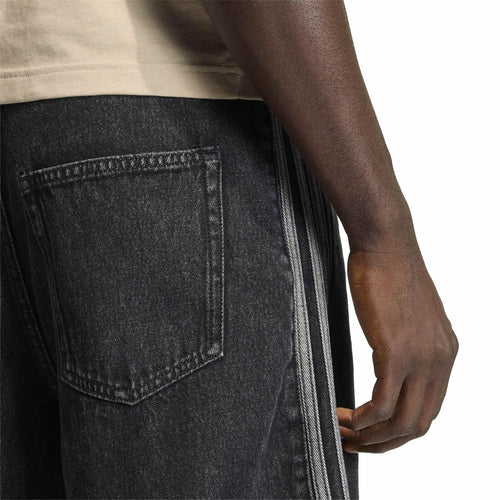 Dark denim shorts close-up: front pocket and double side stripe seam