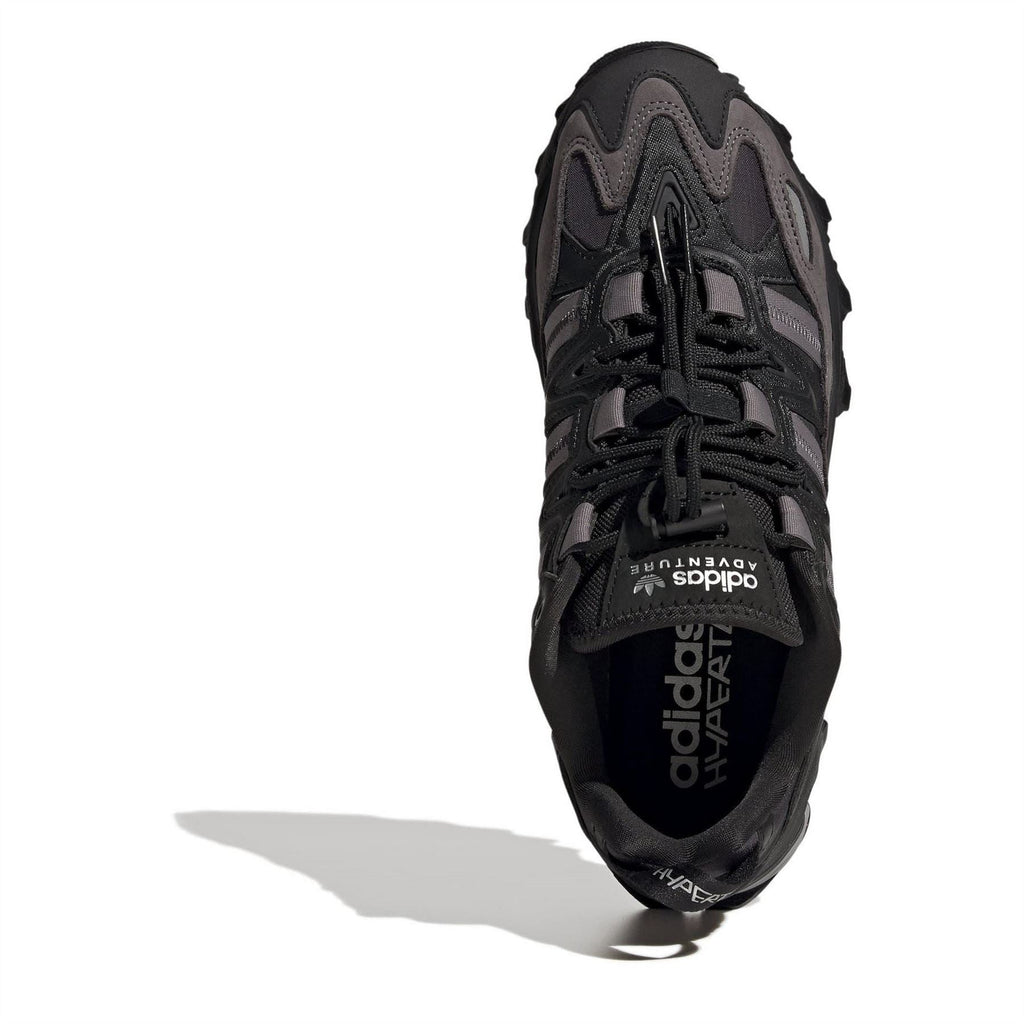 Black adidas sneaker with 'adidas' logo on side and lace-up front.