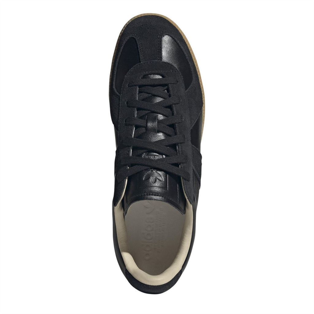 Front view of black adidas Originals low-top sneakers with lace-up closure