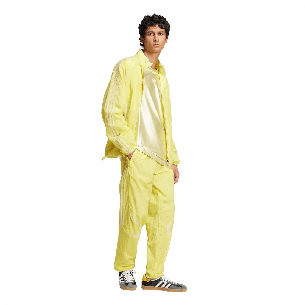 adidas Originals yellow track jogger pants with elastic waist and striped side panels