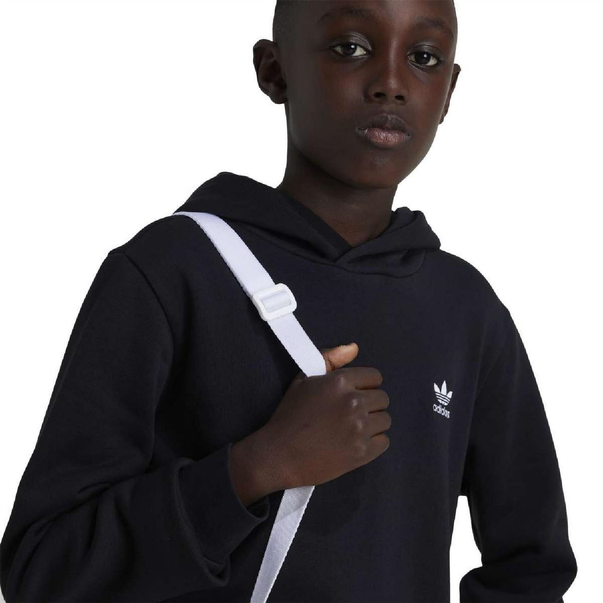 Black hoodie close-up with adidas trefoil logo on chest and hood drawstrings