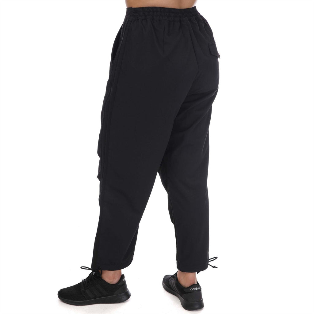 Black adidas Originals woven pants with elastic waist and ankle cuff tie detail