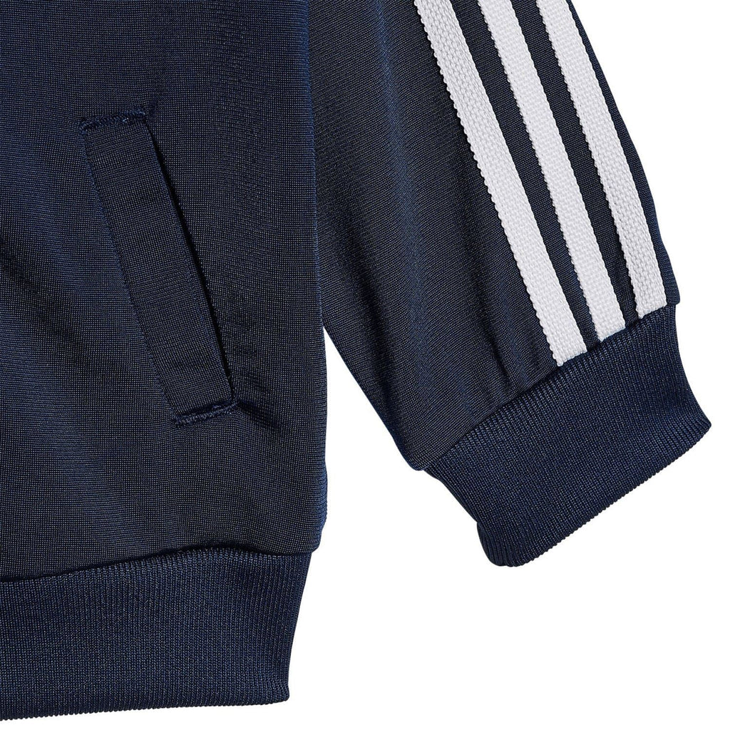 Infants navy tracksuit sleeve with white 3-Stripes and ribbed cuff, pocket detail.