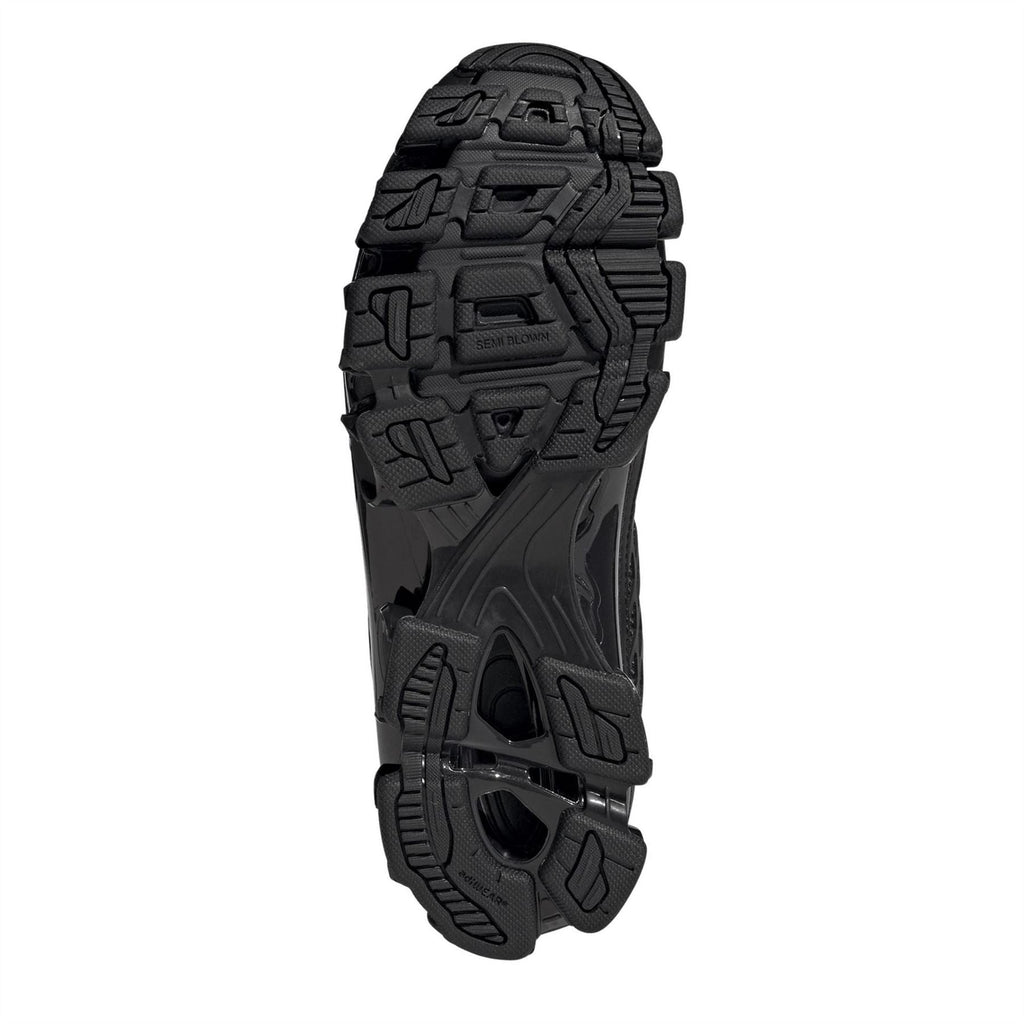 Black adidas Megaride F50 outsole with molded traction pattern and pod details