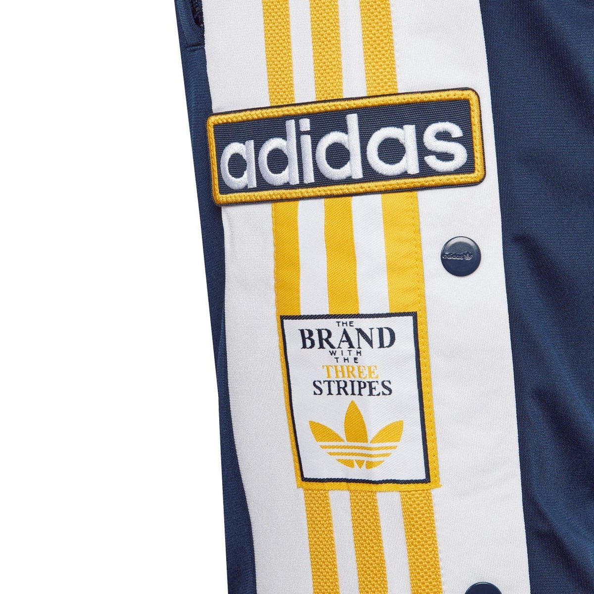 adidas logo patch on navy juniors shorts with yellow and white vertical stripes
