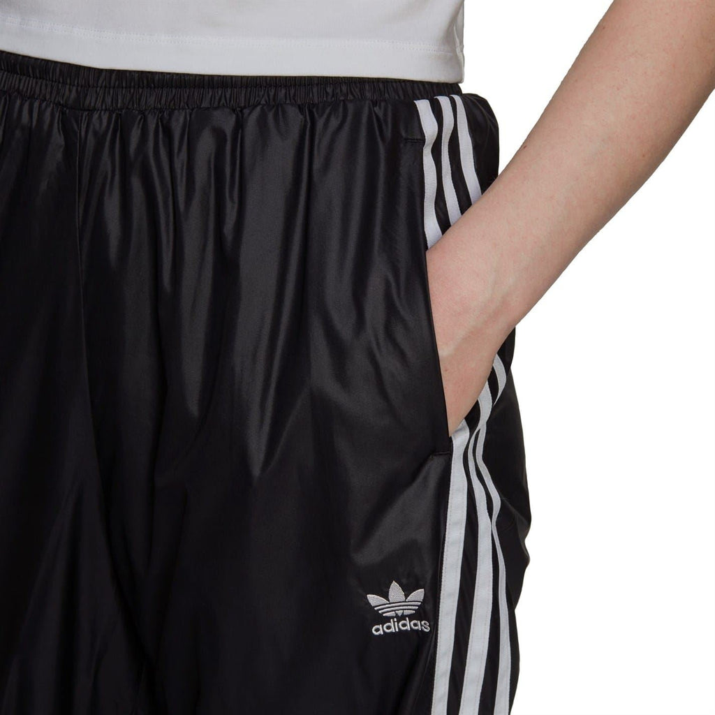 Black adidas track sweatpants with gathered elastic waistband and white side stripe