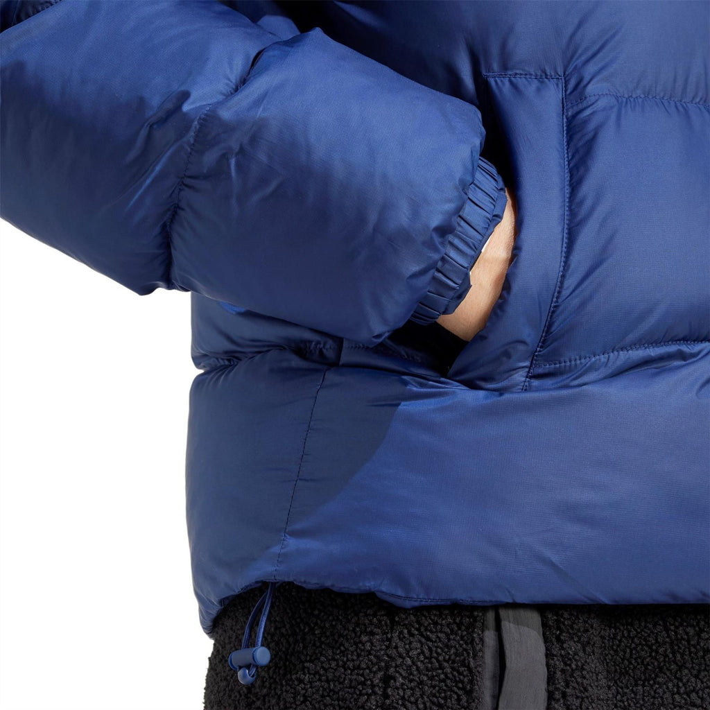 adidas Originals dark blue puffer jacket close-up of quilted sleeves and zip
