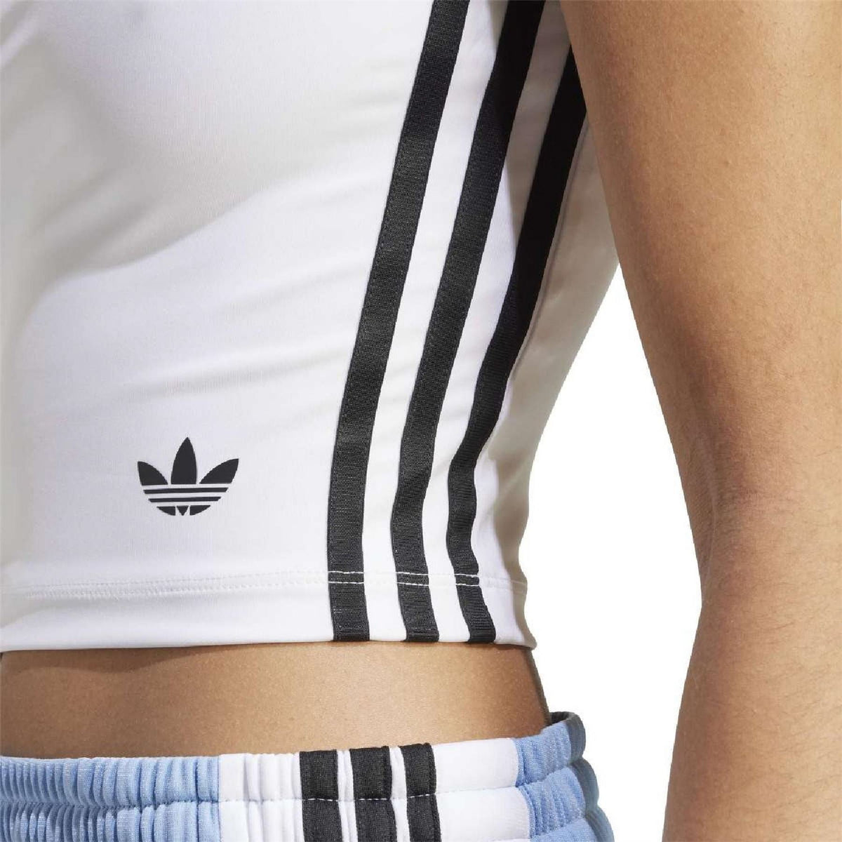 Close-up of white tube top with black adidas 3-stripe side band and Trefoil logo