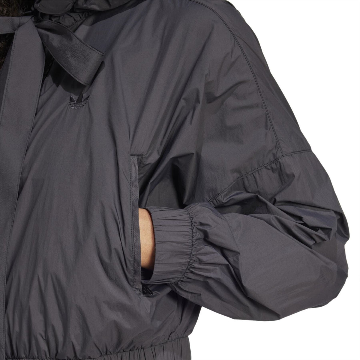 Black bomber jacket with gathered sleeve cuff and front zipper placket detail