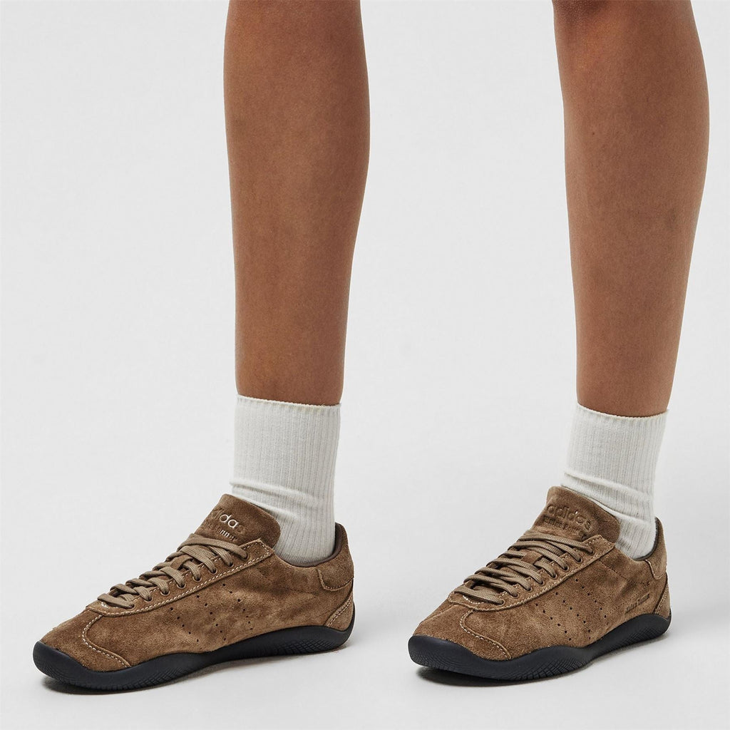 adidas Originals sneakers with white crew socks, earth-brown suede and black sole