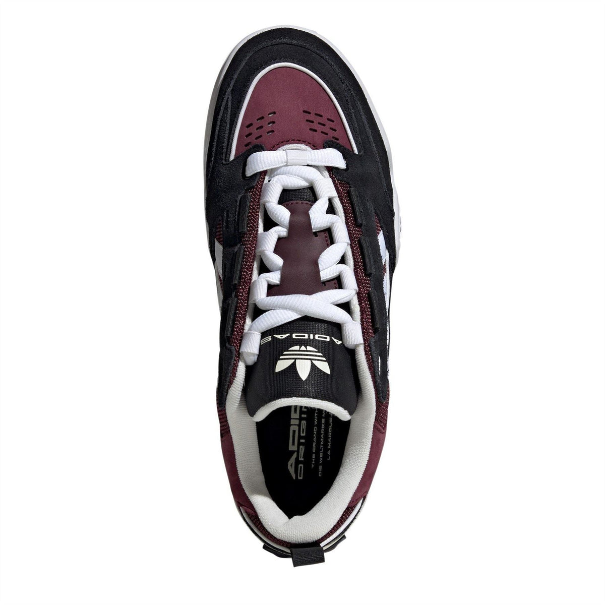 Kids' low-top trainers, front view, black and burgundy with white laces and stripes