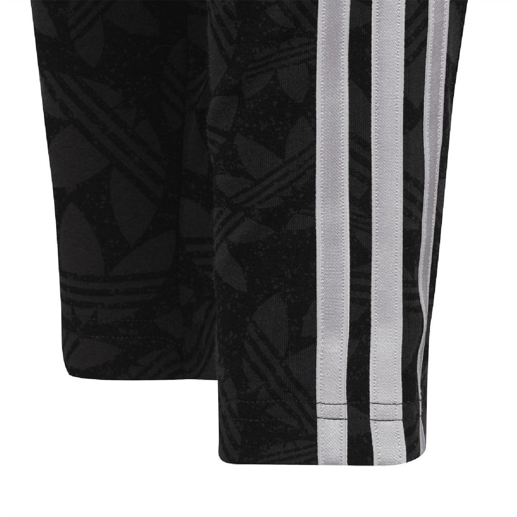 Black adidas leggings with allover print and side white triple stripe detail at hem