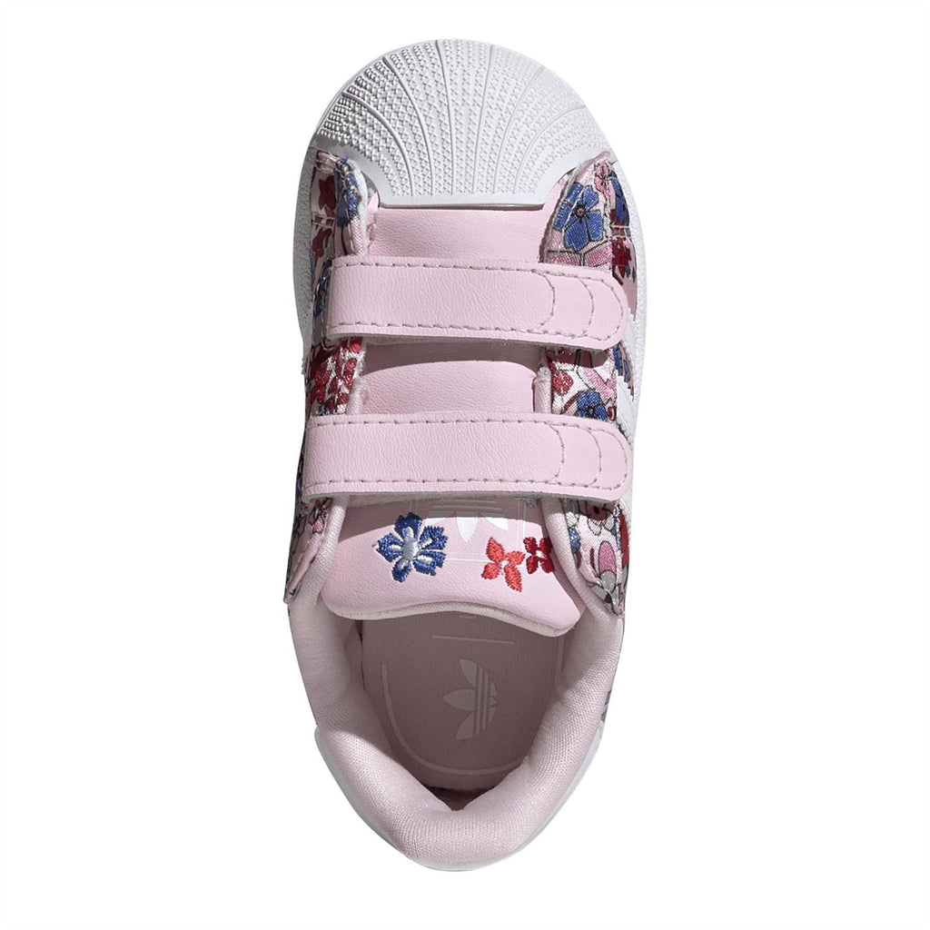 Kids sneaker toe with hook-and-loop strap, floral print upper, and cushioned lining