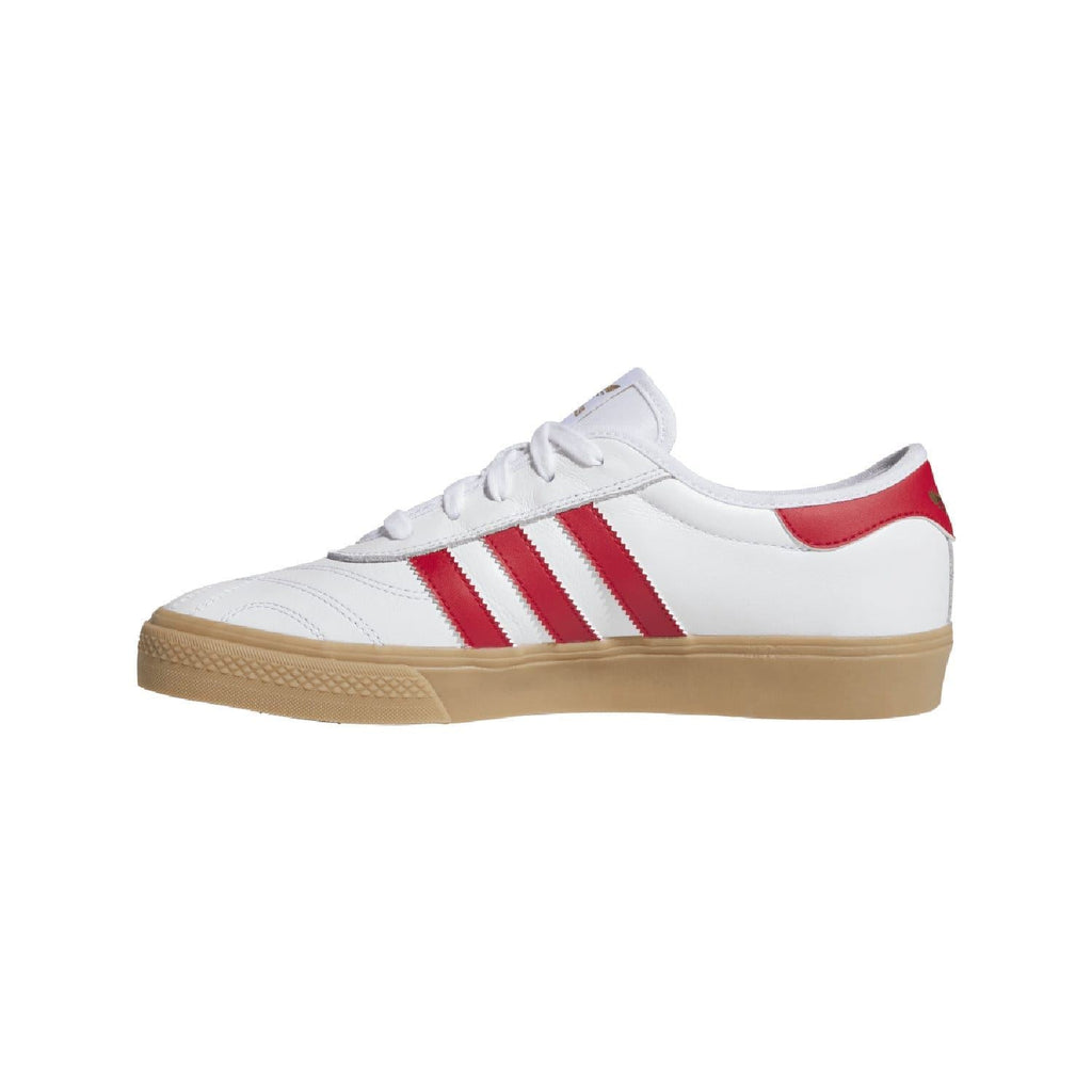 White adidas Adiease trainers with red triple stripes and gum-brown trim