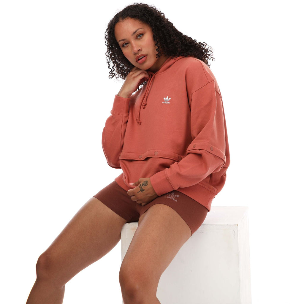 Pink hoodie with hood drawstrings and snap-button waistband, trefoil logo on chest