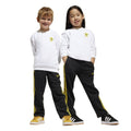 Kids crew sweatshirt and joggers set: white top with yellow Smileys, black pants with stripes.