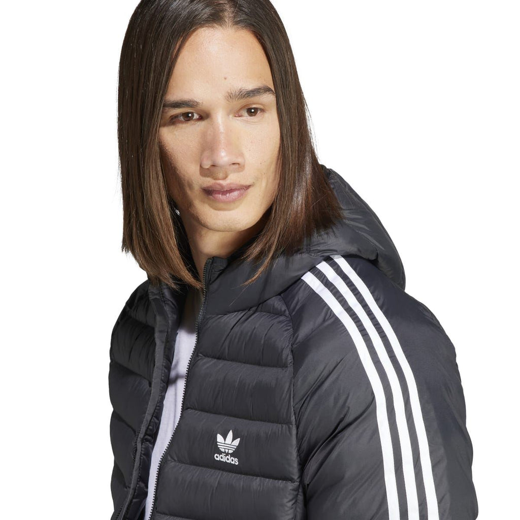 Adidas black hooded puffer jacket close-up with face view, zip front, and white sleeve stripes