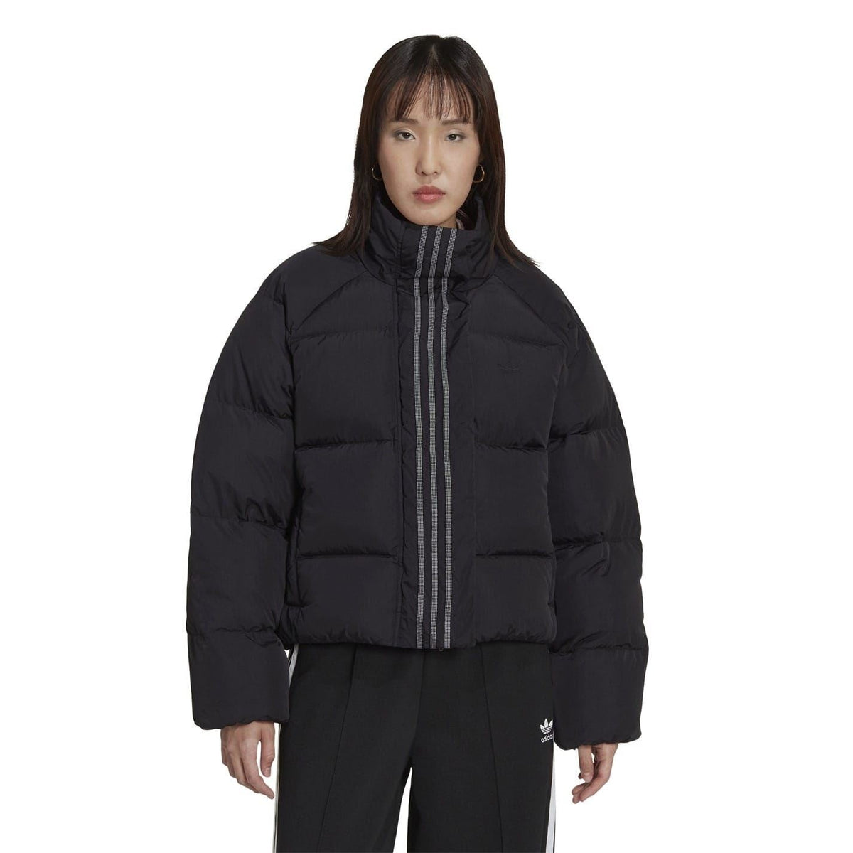 adidas Originals short down jacket with a sleek design, featuring a puffy insulated look and a zip-up front for warmth and style