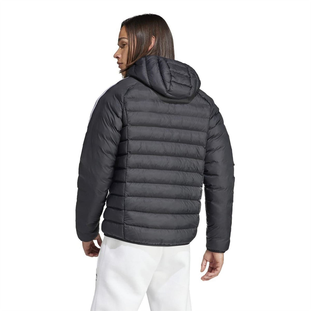 adidas Originals hooded puffer jacket in black, featuring a quilted design, front zipper, and adjustable hood for cold weather.