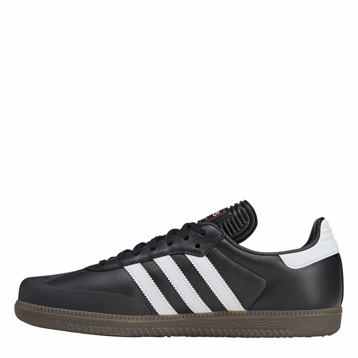 Black low-top sneakers with white adidas stripes and black ribbed tongue patch
