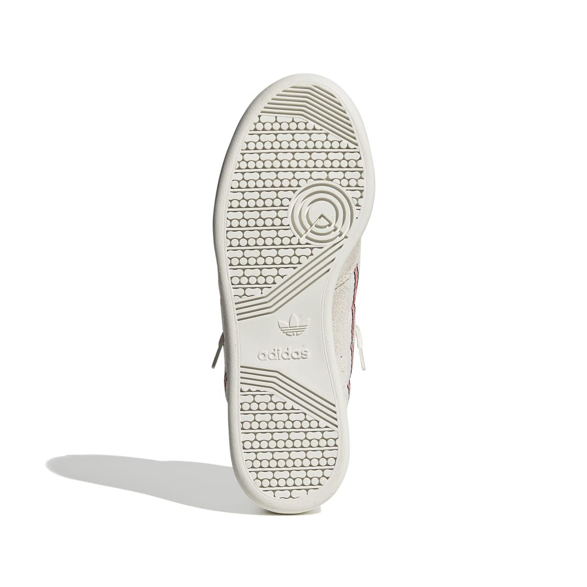 Light beige trainer outsole with textured tread and circular adidas logo mark