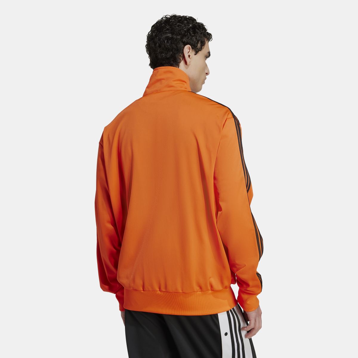 adidas Originals Adicolor Classics Firebird Track Top in vibrant colors, featuring a retro sporty design with ribbed cuffs and zip closure.