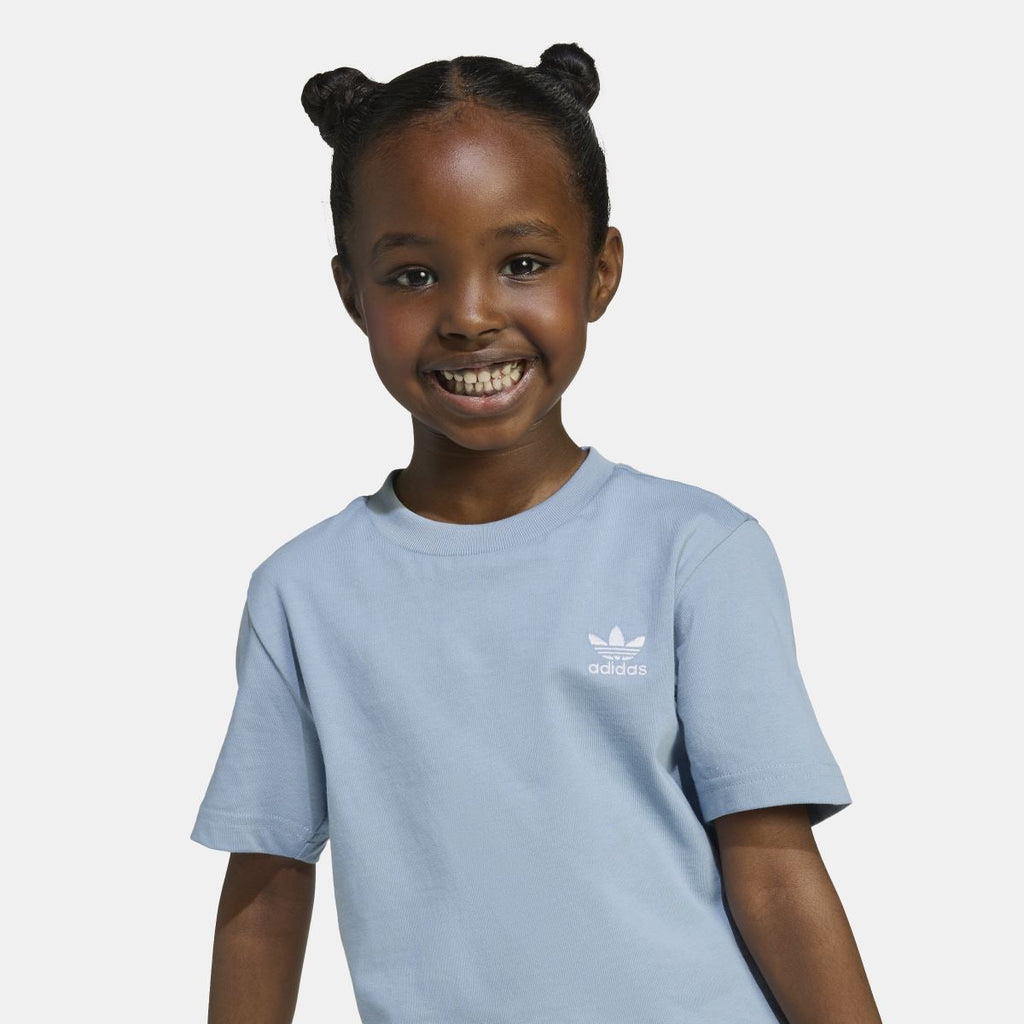 Light blue adidas kids T-shirt close-up, crew neck with small chest logo.