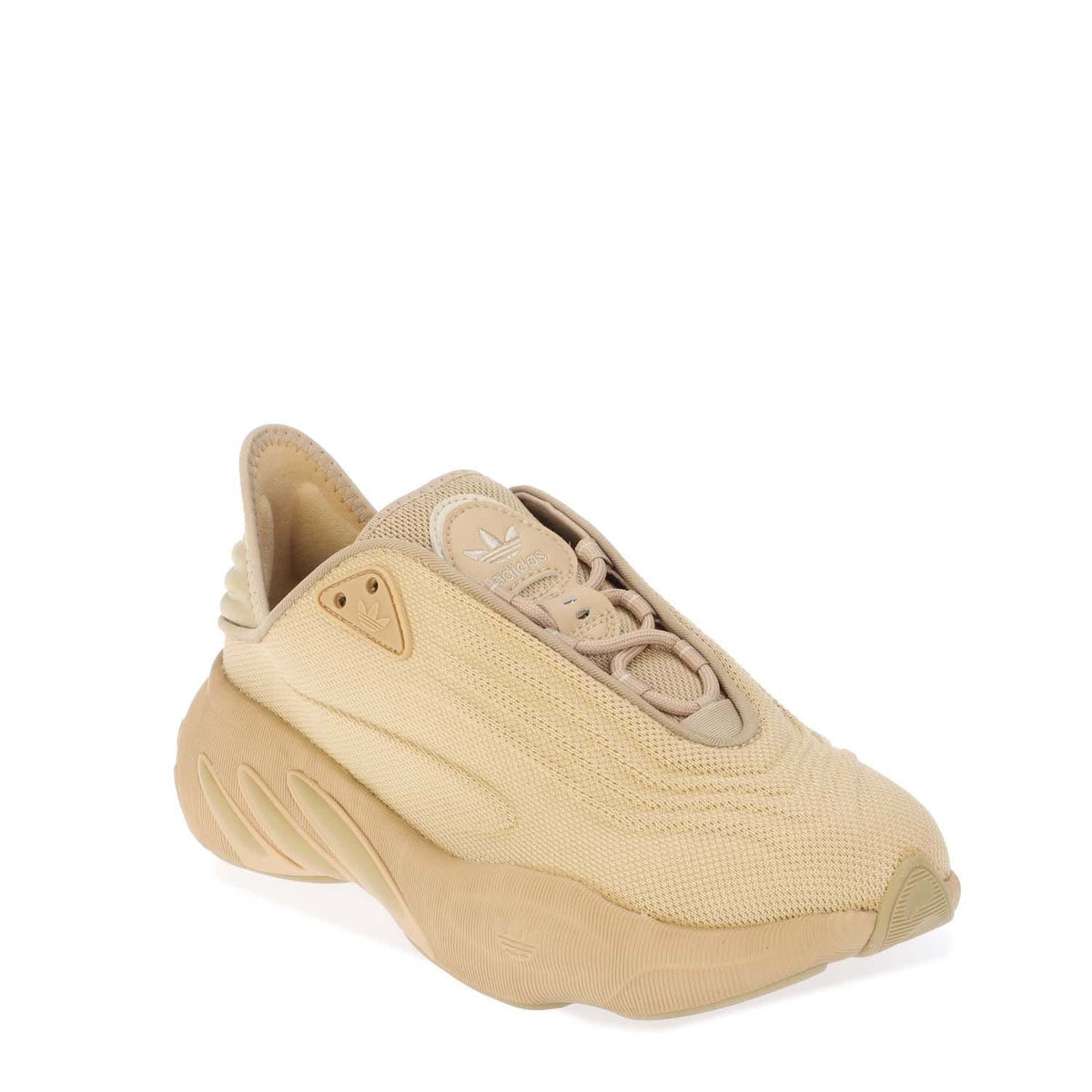 Beige slip-on trainers with lace-up front, cushioned collar, chunky sole