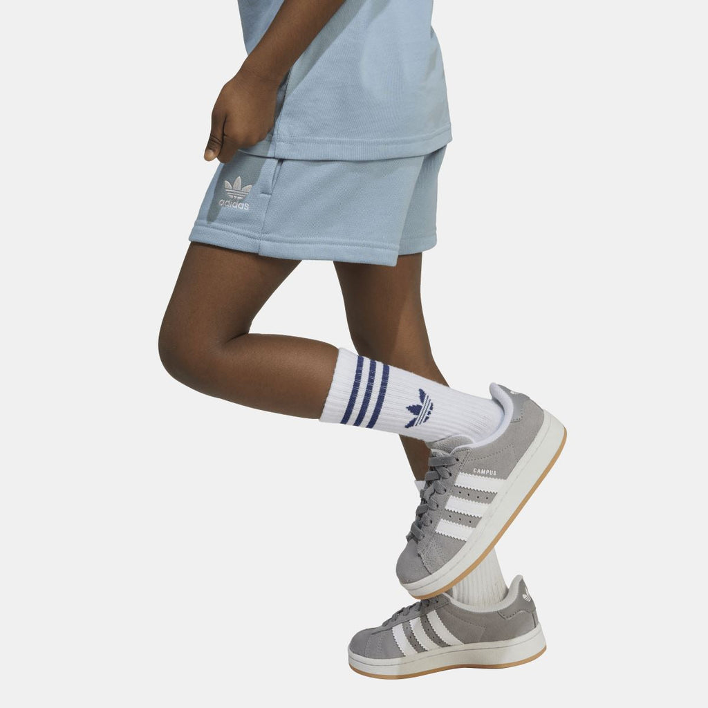 Light blue adidas T-shirt and shorts hem detail, with small side logo on shorts.