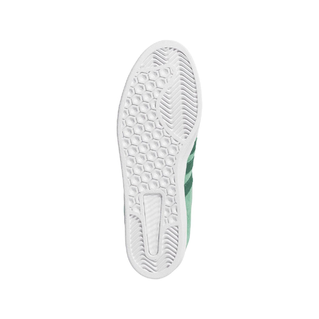 White rubber outsole with textured traction pattern and green sidewall