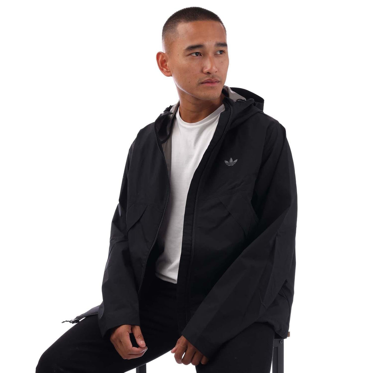 Black adidas Originals tech shell jacket with hood and oversized front pockets