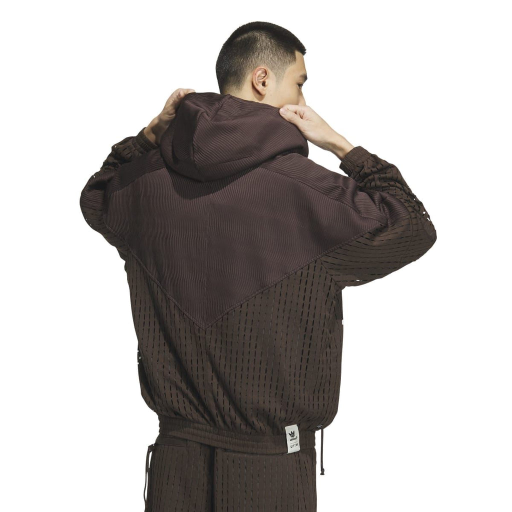 Brown hooded windbreaker jacket, back view, with perforated pattern and drawstring hem