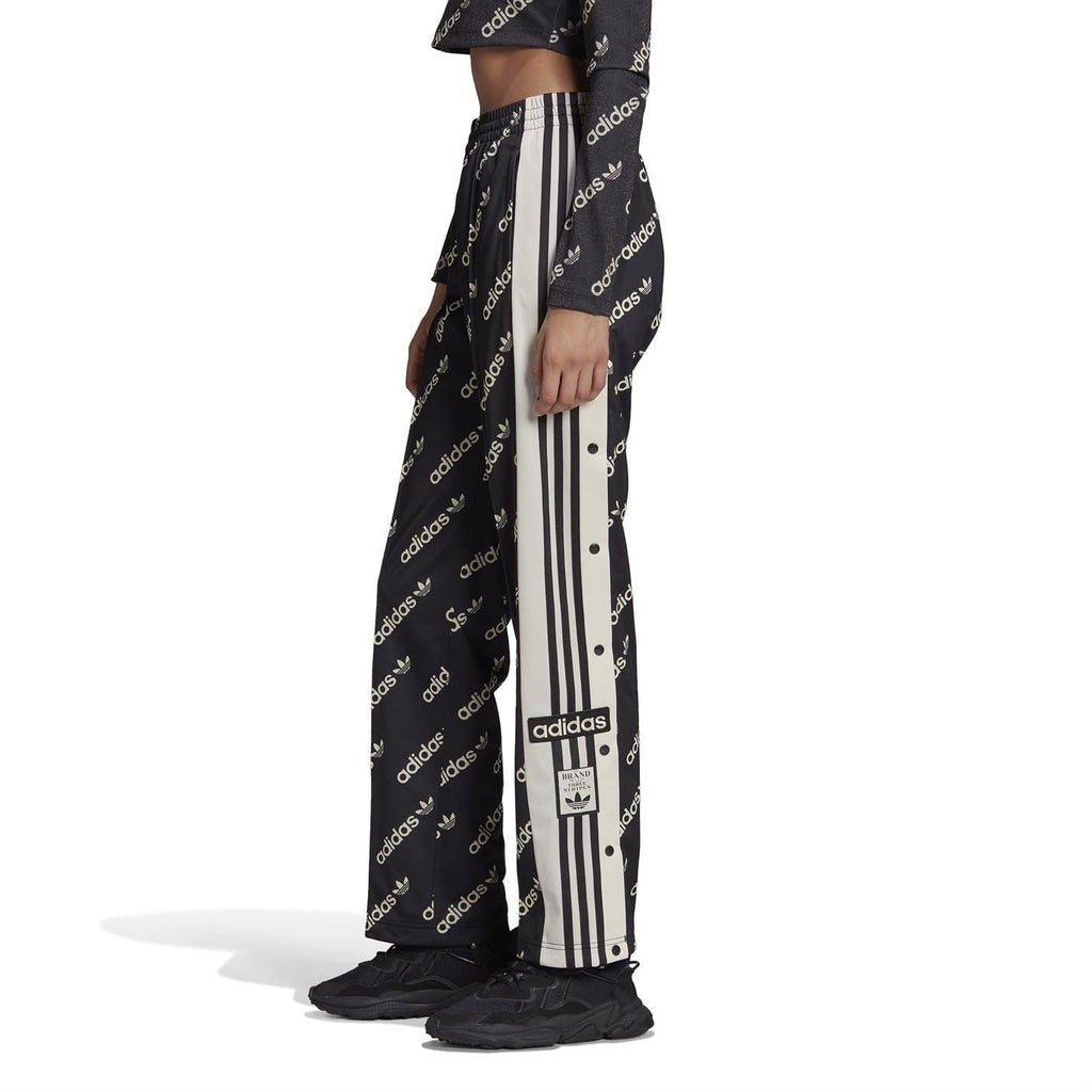 Black jogger sweatpants with allover adidas print and contrasting vertical side stripes