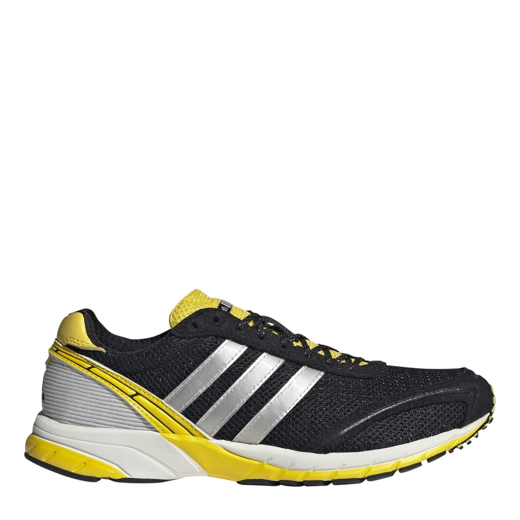 Black mesh low-top sneakers with silver stripes, yellow collar and heel, white midsole