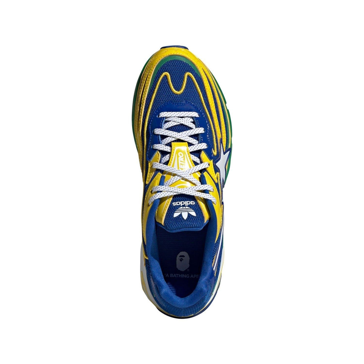 Trainers top view with blue and yellow upper, white laces, green trim around toe