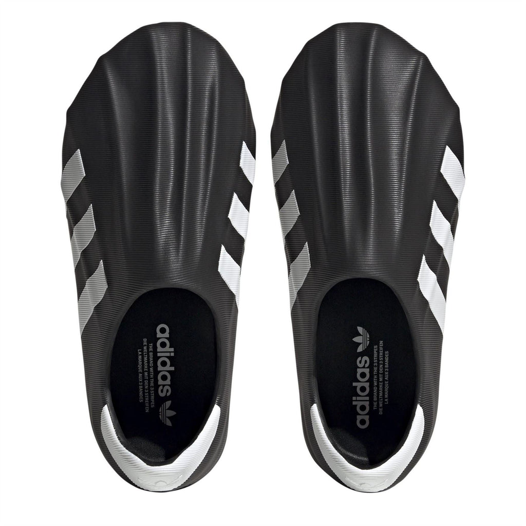 adidas Originals Superstar Slip On Trainers showing black slip-on sneakers with classic white sole and iconic branding