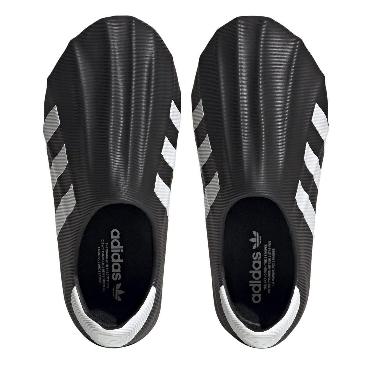 adidas Originals Superstar Slip On Trainers showing black slip-on sneakers with classic white sole and iconic branding