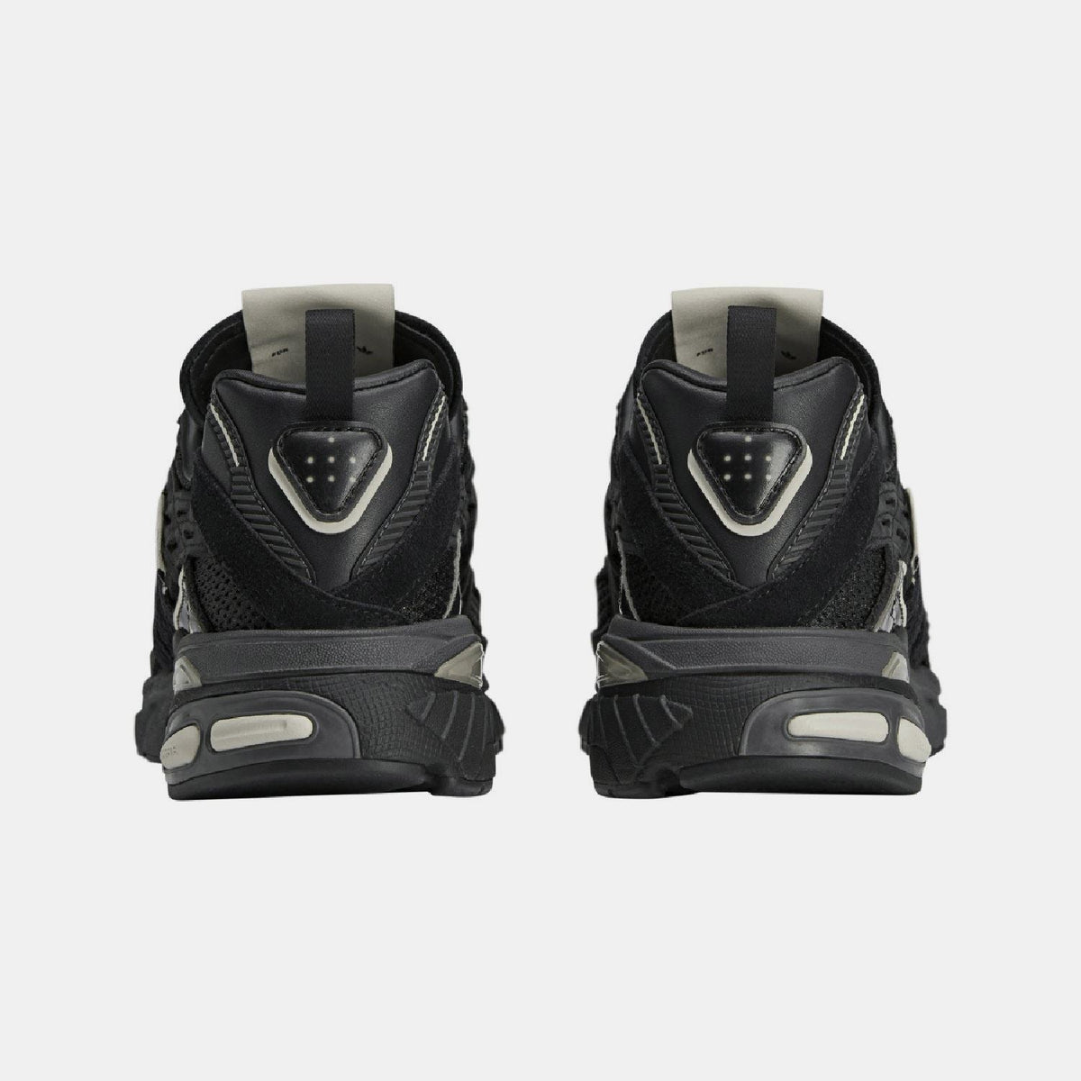 adidas Originals Adistar Cushion STFM trainers showing navy and white athletic footwear with cushioned soles and stylish design
