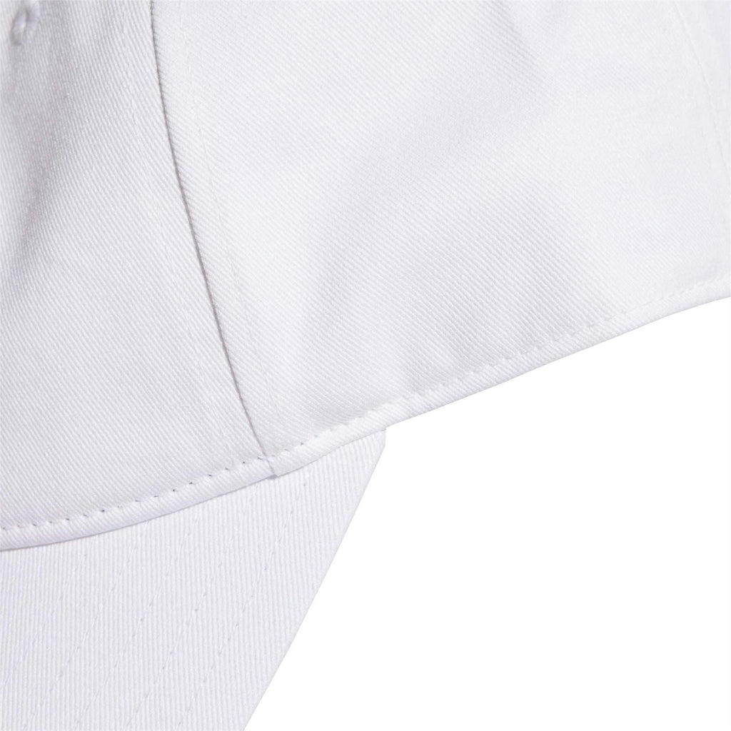White baseball cap brim close-up with stitched edge