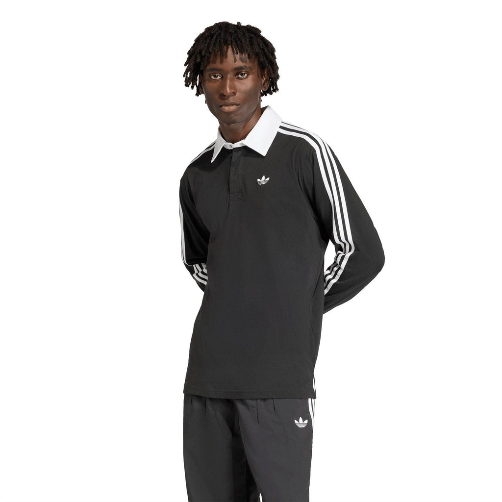Black long-sleeve collared shirt with white triple sleeve stripes and small adidas logo