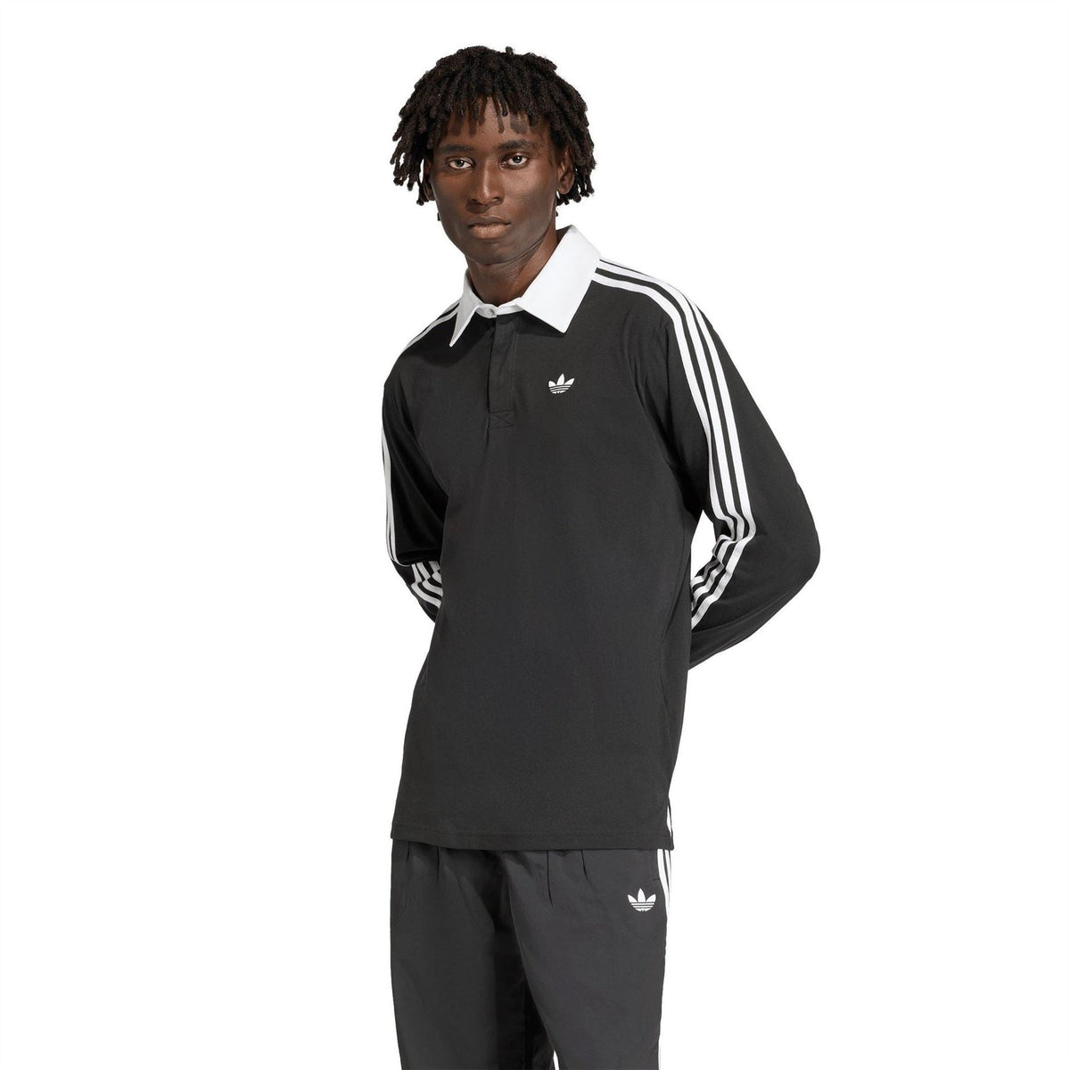 Black long-sleeve collared shirt with white triple sleeve stripes and small adidas logo