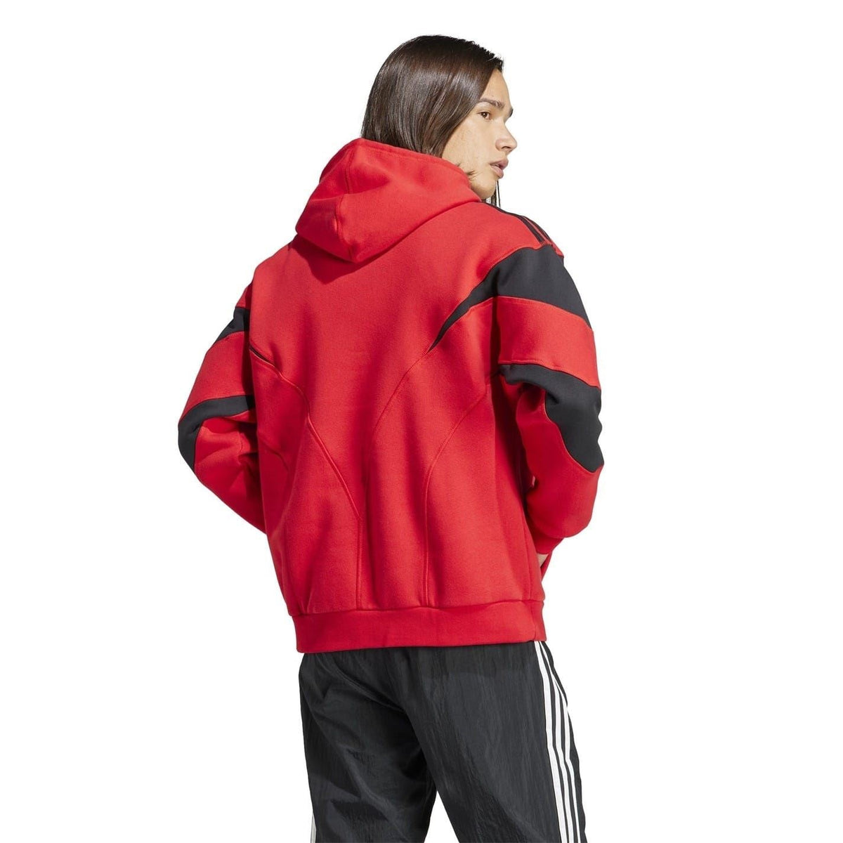 Red hooded sweatshirt with black sleeve panels, shown from the side.
