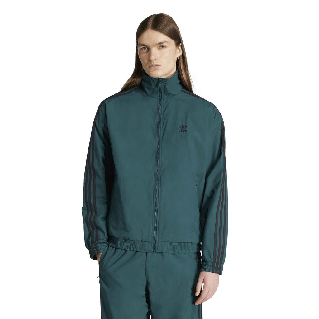 Women’s adidas teal zip-up track jacket with stand collar and three-stripe sleeves