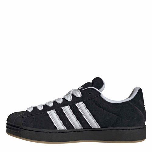 Black adidas low-top sneakers, white stripes and lace-up closure, light gum sole