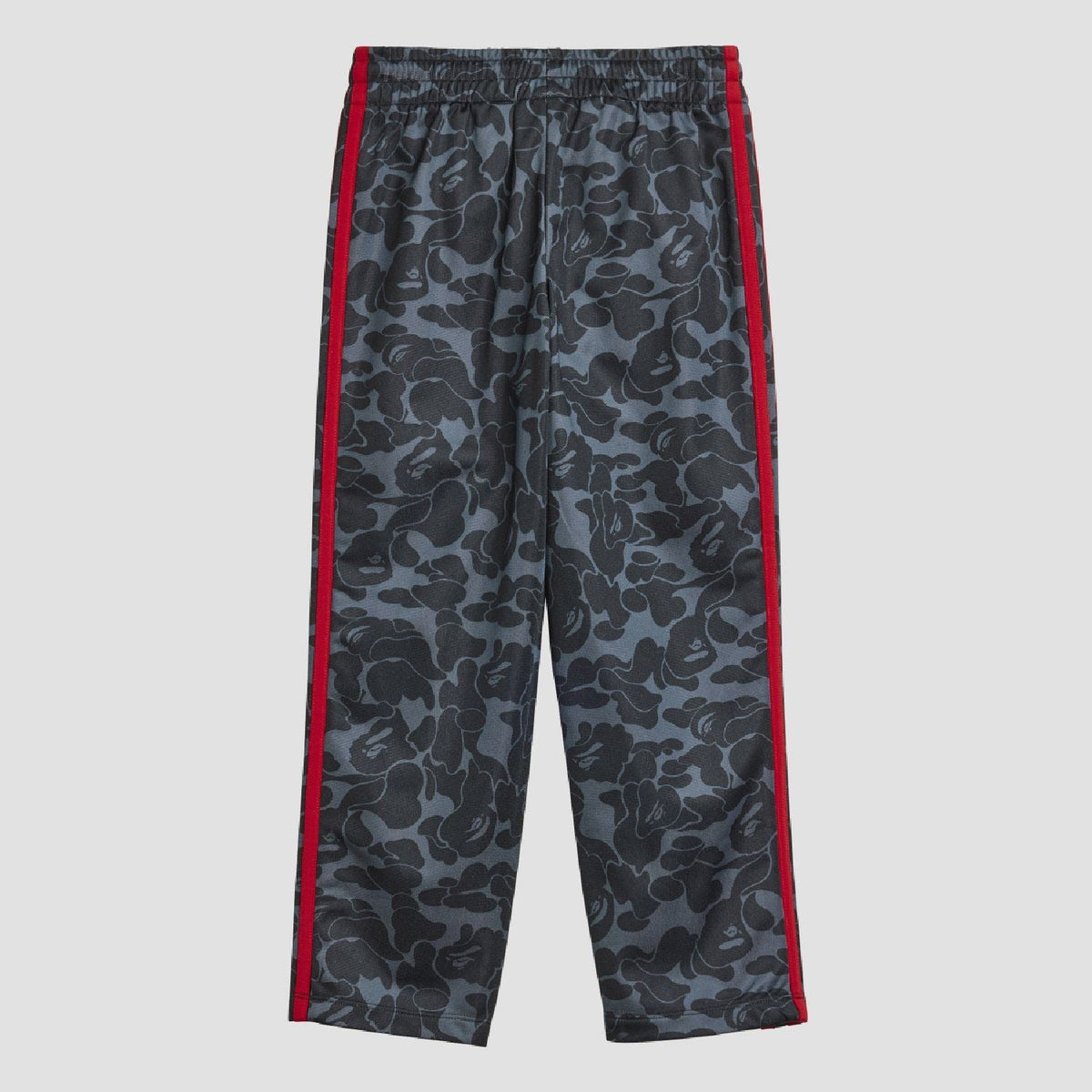 Kids camo track pants with red side stripes and elastic waistband