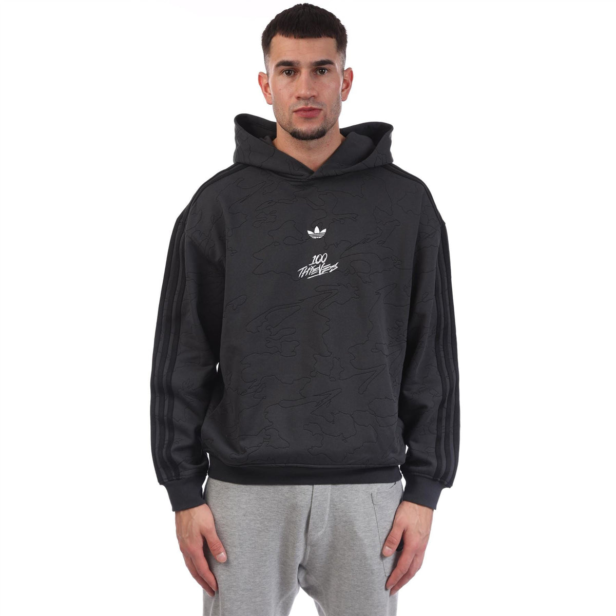 Black pullover hoodie with hood, front graphic logo, and ribbed cuffs